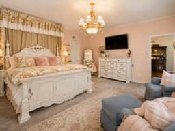 Unwind in The Beland’s Blushing Rose Suite—King Comfort in Grand Colonial Style - Image 2