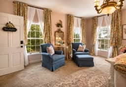 Unwind in The Beland’s Blushing Rose Suite—King Comfort in Grand Colonial Style - Image 5